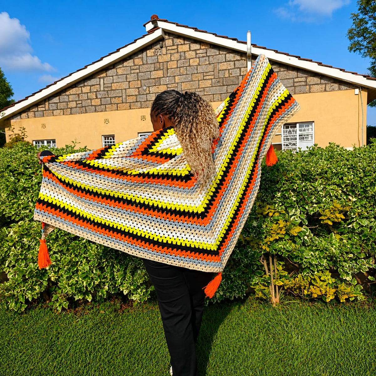 Woman wearing a peackock poncho